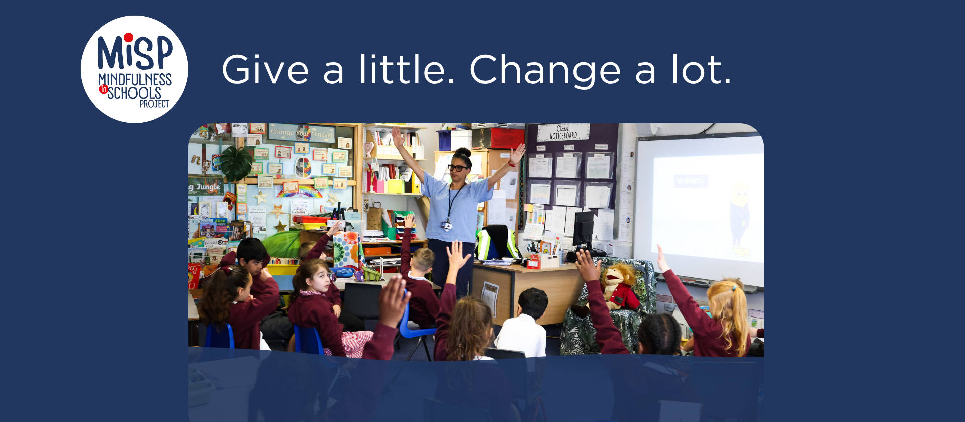 Female teacher standing with group of primary school children in the playground